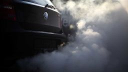 FILED - 21 February 2018, Germany, Wickede: View of the  exhaust pipe and its smoke from a BMW in a factory in Wickede. As sixth biggest car manufacturer BMW now faces a US lawsuit for apparent exhaust deceptions in diesel cars. Photo: Ina Fassbender/dpa (Photo by Ina Fassbender/picture alliance via Getty Images)