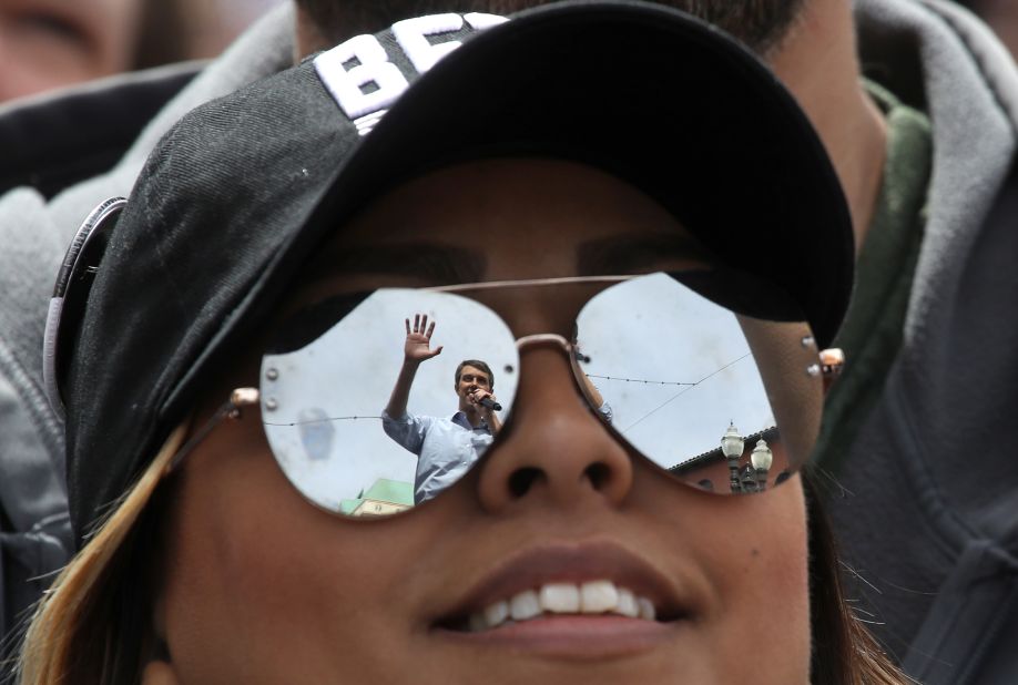 O'Rourke is reflected in a supporter's sunglasses as he speaks during a campaign rally in El Paso in March 2019.