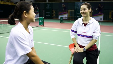 Li Na's grand slam breakthrough at the 2011 French Open led to a tennis revolution in China, which has invested heavily in growing the game both on a grass-roots and elite level. Here Li is talking to one of China's top junior players in March in Beijing.