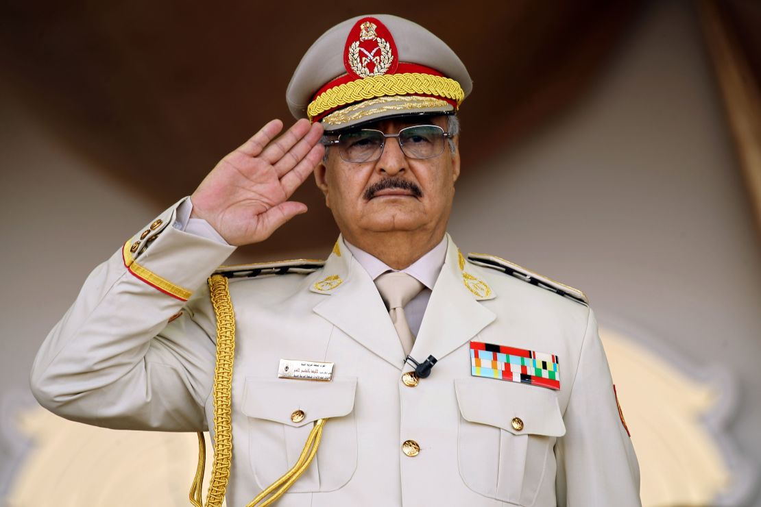 General Khalifa Haftar salutes during a military parade in Benghazi on May 7, 2018.