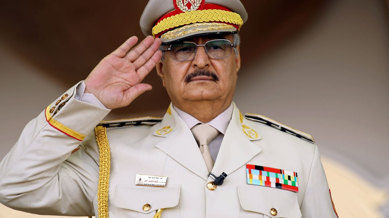 Libyan strongman Khalifa Haftar salutes during a military parade in 2018. 