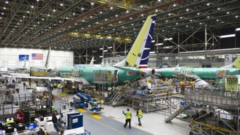 Employees work on Boeing 737 MAX airplanes at the Boeing Renton Factory in Renton, Washington on March 27, 2019