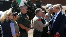 President Donald Trump visits a new section of the border wall with Mexico in Calexico, Calif., Friday April 5, 2019. at left is Homeland Security Secretary Kirstjen Nielsen. (AP Photo/Jacquelyn Martin)