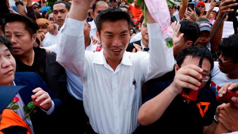 Thailand's Future Forward Party leader Thanathorn Juangroongruangkit is mobbed by his supporters at a police station in Bangkok on Saturday.