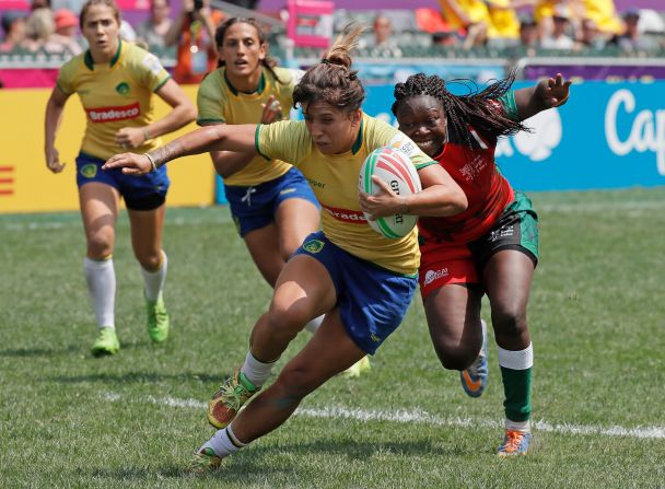 Brazil's Luiza Gonzalez Da Costa Campos, center, is tackled by Kenya's Janet Owino during their Hong Kong Sevens semifinal match. Brazil went on to win 17-5.