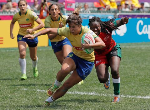 Brazil's Luiza Gonzalez Da Costa Campos, center, is tackled by Kenya's Janet Owino during their Hong Kong Sevens semifinal match. Brazil went on to win 17-5. 