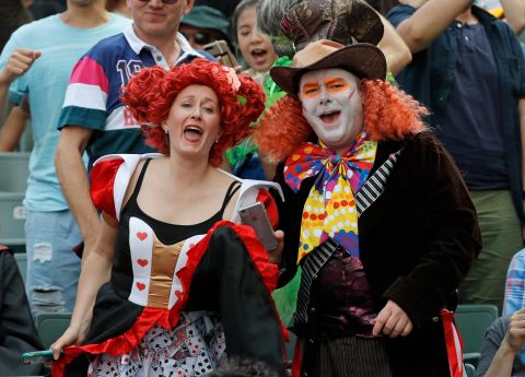 Rugby fans dress as characters from the movie "Alice in Wonderland" during the Hong Kong Sevens rugby tournament.