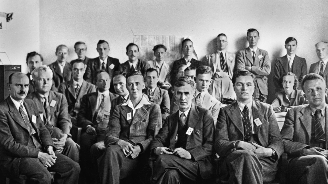 Eric Burhop (seated, fourth from left, partially obscured) and the rest of the British Group associated with the Manhattan Project, also known as the Mark Oliphant Group