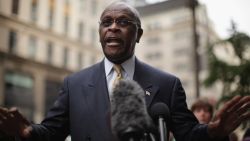 Republican presidential candidate Herman Cain speaks to the media outside of Trump Towers before a scheduled appearance with real estate mogul Donald Trump on October 3, 2011 in New York City. 