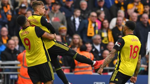 Troy Deeney lifts Gerard Deulofeu in joy during Watford's FA Cup semifinal win over Wolves.