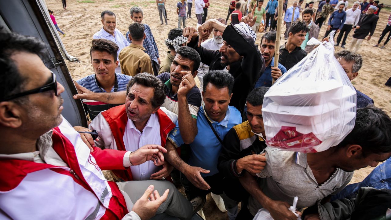 A helicopter carrying aid in the flooded village of Bamdezh, April 5.