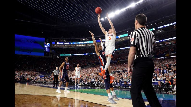 Kyle Guy of the Virginia Cavaliers is fouled by Auburn Tigers guard Samir Doughty while attempting a three-point shot with seconds remaining in their Final Four game on April 6, in Minneapolis. Guy made all three of his foul shots to win the game and <a href="index.php?page=&url=https%3A%2F%2Fwww.cnn.com%2F2019%2F04%2F06%2Fsport%2Fncaa-mens-final-four-virginia-auburn-michigan-state-texas-tech%2Findex.html" target="_blank">advance the Cavaliers</a> to the championship game on Monday, April 8.