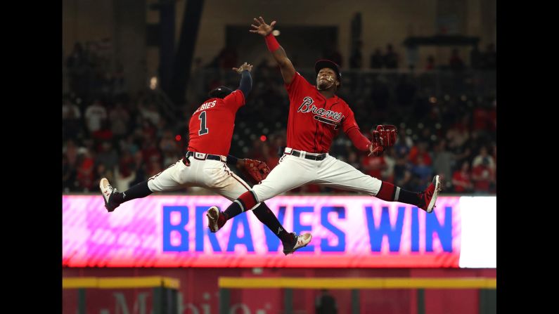 Atlanta Braves teammates Ozzie Albies, left, and Ronald Acuna Jr. celebrate their win against the Miami Marlins at SunTrust Park in Atlanta on Friday, April 5.