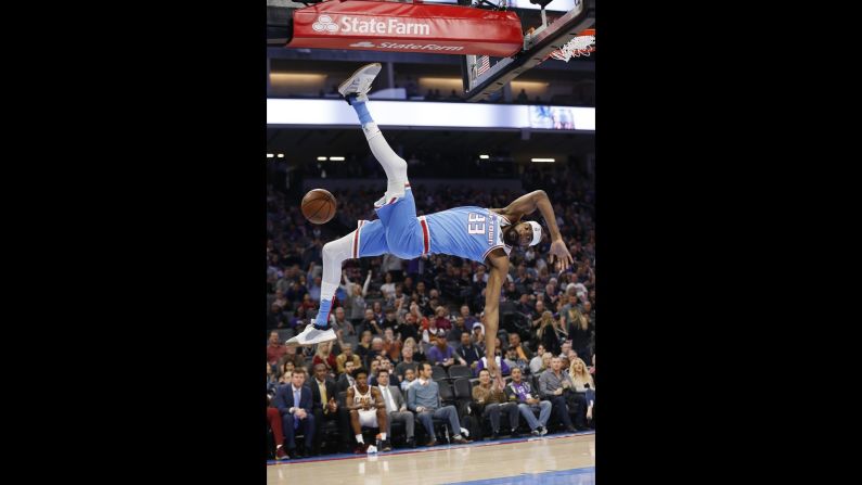 Sacramento Kings guard Corey Brewer falls to the court after dunking the ball during the first quarter of an NBA game against the Cleveland Cavaliers in Sacramento, California, on Thursday, April 4.