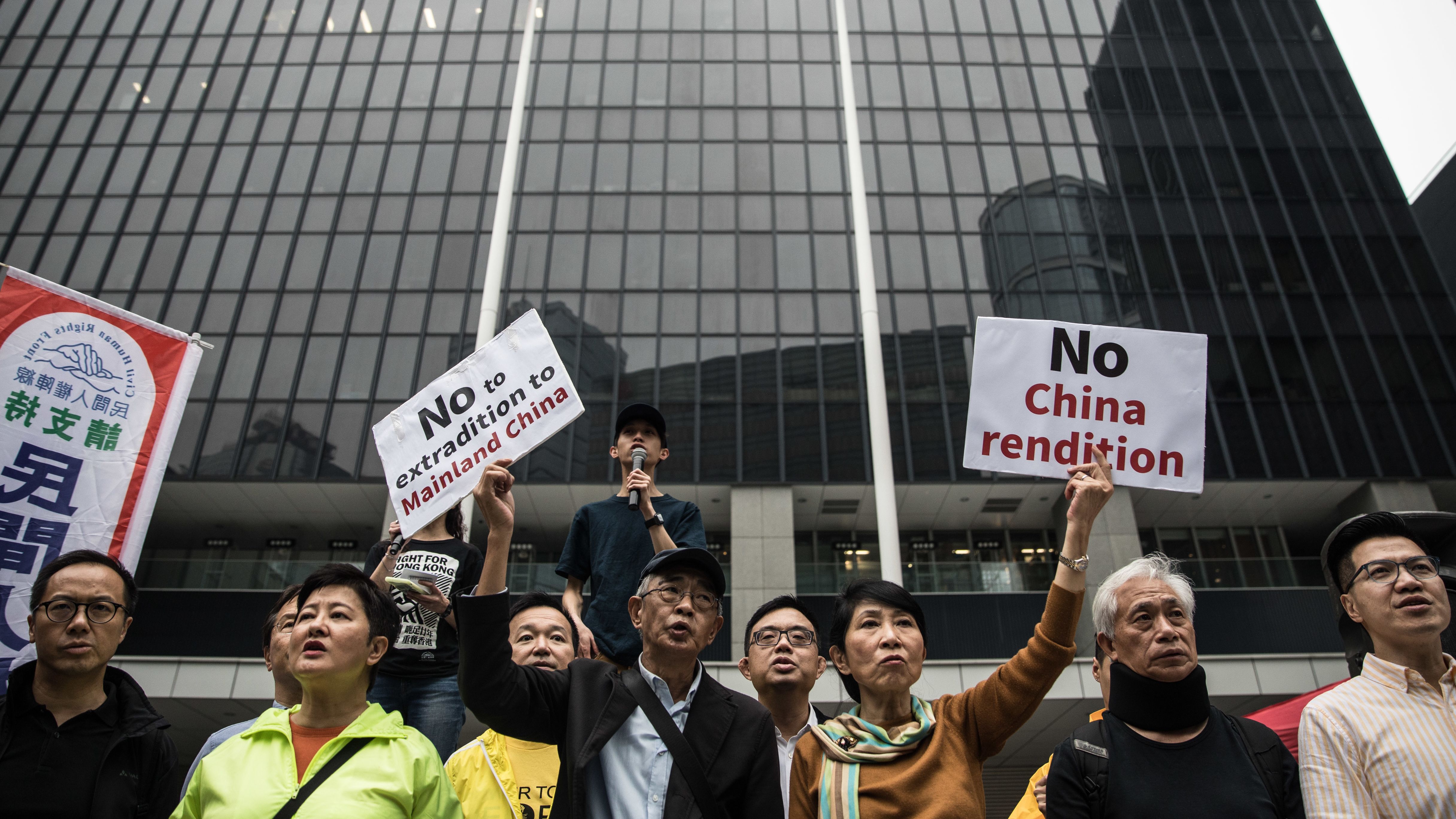 Hong Kong pro-democracy legislator Claudia Mo (center right) and bookseller Lam Wing-kee (center left) protest the government's plans to approve an extradition deal with mainland China.