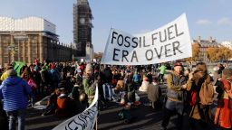 Demonstrators take part in a pro-environment protest as they block Westminster Bridge, near the Houses of Parliament in central London on November 17, 2018, to show anger at what they see as government inaction on climate and ecological issues. - Organised by Extinction Rebellion, the protest is part of many taking place this weekend to bring attention to what they describe as political inaction on issues of pollution and climate change. (Photo by Tolga AKMEN / AFP)        (Photo credit should read TOLGA AKMEN/AFP/Getty Images)