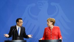 German Chancellor Angela Merkel, right, and Chinese Premier Li Keqiang, left, brief the media during a meeting in the chancellery in Berlin, Monday, July 9, 2018. (AP Photo/Miriam Karout)