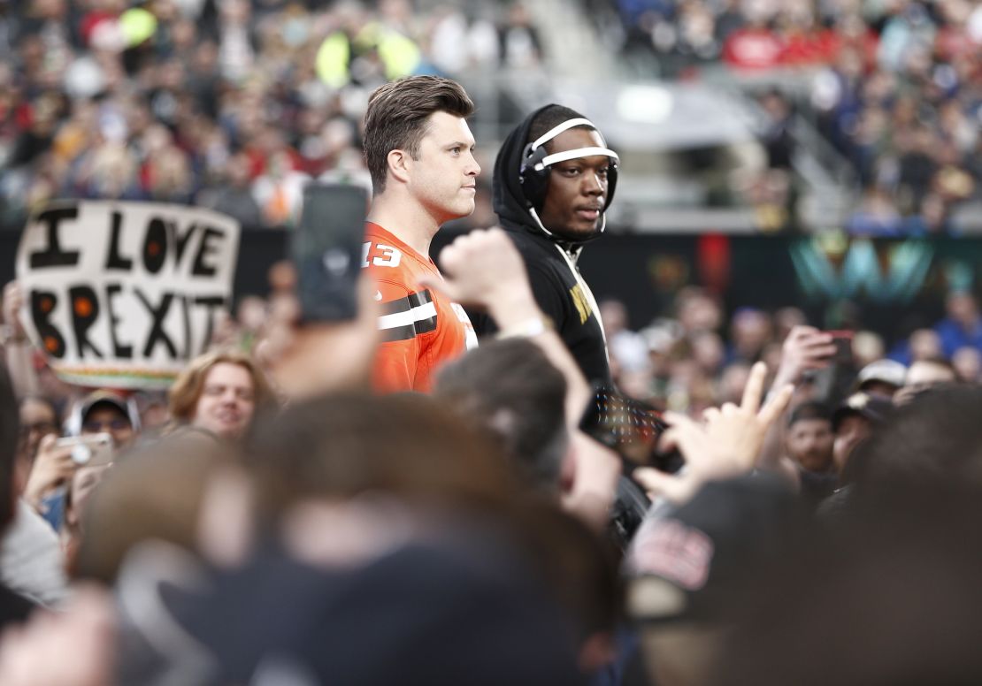 SNL's Michael Che and Colin Jost enter the ring at WWE WrestleMania at Met Life Stadium.
