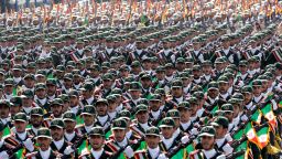 In this Friday, Sept. 21, 2012 file photo, Iran's Revolutionary Guard troops march during a military parade commemorating the start of the Iraq-Iran war 32 years ago, in front of the mausoleum of the late revolutionary leader Ayatollah Khomeini, just outside Tehran, Iran.