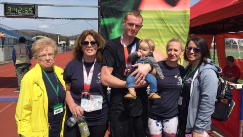 Firefighter Ryan Robeson with family and friends after completing a half marathon April 7 in Scranton.