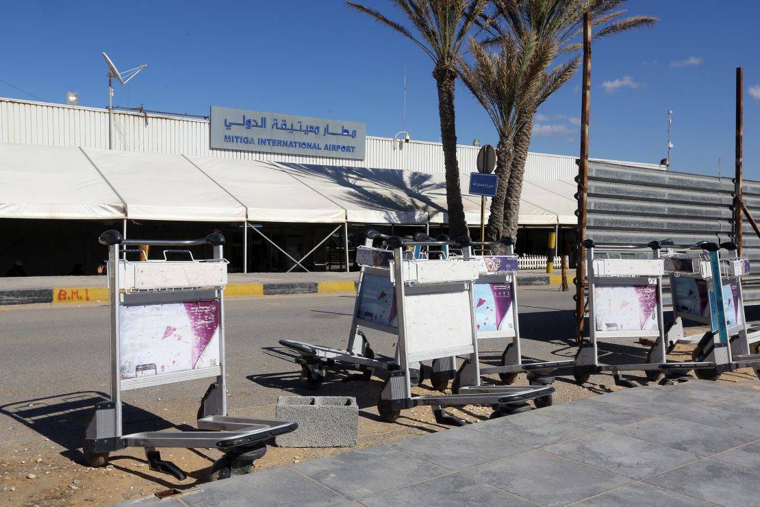 Luggage trolleys lie in front of the gate of the Mitiga airport after it was attacked Monday.