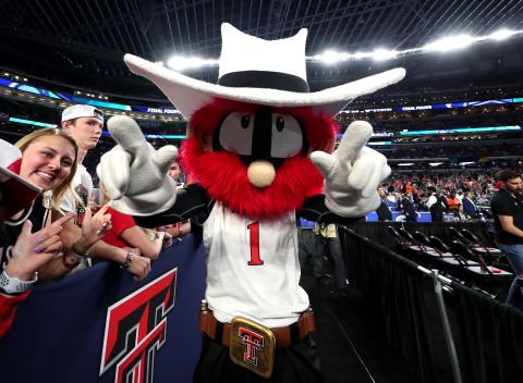 Texas Tech's mascot, Raider Red, does the school's "guns up" salute.