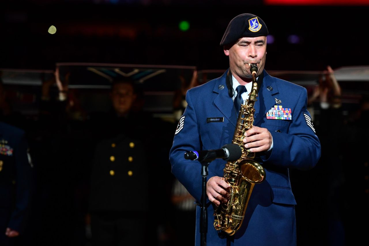 Air Force Tech Sgt. Johnny Holliday plays the National Anthem on the saxophone.
