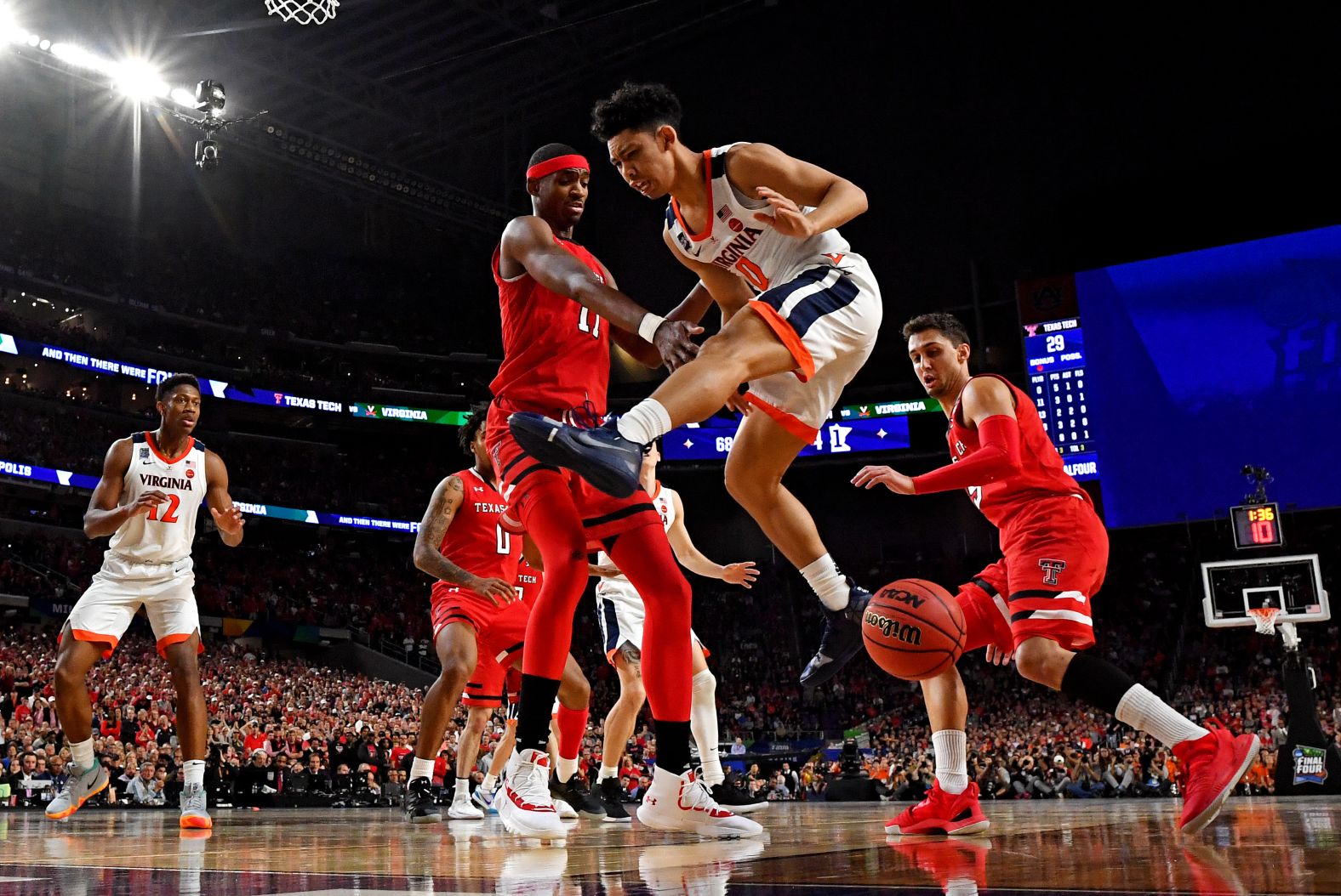 Owens knocks the ball away from Clark in the first half.
