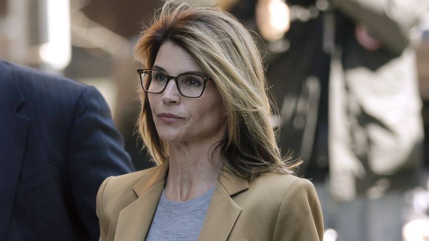 Lori Loughlin arrives at federal court in Boston on Wednesday, April 3, 2019, to face charges in a nationwide college admissions bribery scandal. (AP Photo/Steven Senne)