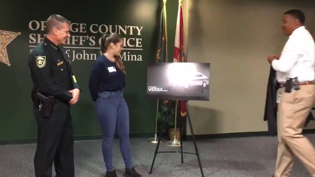 The Orange County Sheriff's Office shows Samantha Rodriguez a photo of her new car.
