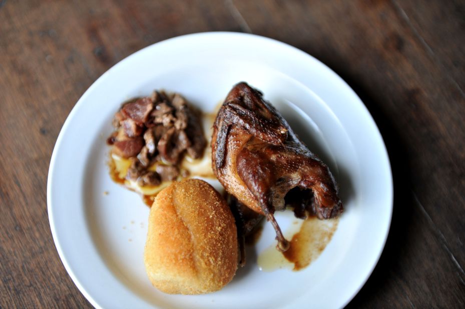This is fried Quail partnered with minced chicken liver, bacon and bread. 