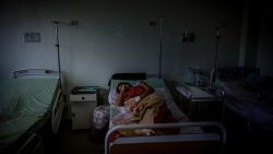 A patient lays on a bed inside the Ana Teresa de Jesus Ponce maternity hospital in Macuto, Venezuela, on Friday, Feb. 22, 2019. Venezuela's healthcare system, a shining example in Latin America back when the government had the money for ambitious programs, has been crumbling for many years: nearly half the country's doctors have left and hospital regularly go without the necessary equipment needed to fully function. Photographer: Adriana Loureiro Fernandez/Bloomberg via Getty Images