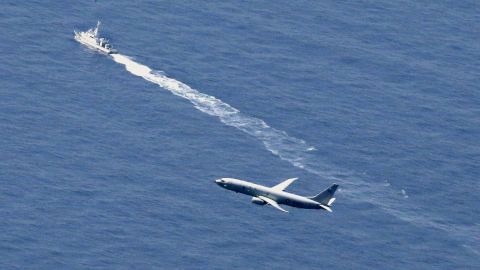 A Japan Coast Guard's vessel and U.S. military plane search for a Japanese F-35 fighter jet, in the waters off Aomori, northern Japan on Wednesday.
