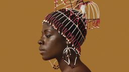 Kwame Brathwaite, Sikolo Brathwaite wearing a headpiece designed by Carolee Prince, African Jazz-Art Society & Studios (AJASS), Harlem, ca. 1968; from Kwame Brathwaite: Black Is Beautiful (Aperture, 2019)