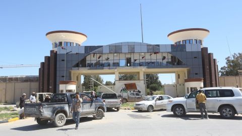 Gun-mounted vehicles belonging to fighters loyal to the internationally recognised GNA are pictured near a military compound in a suburb of Tripoli.
