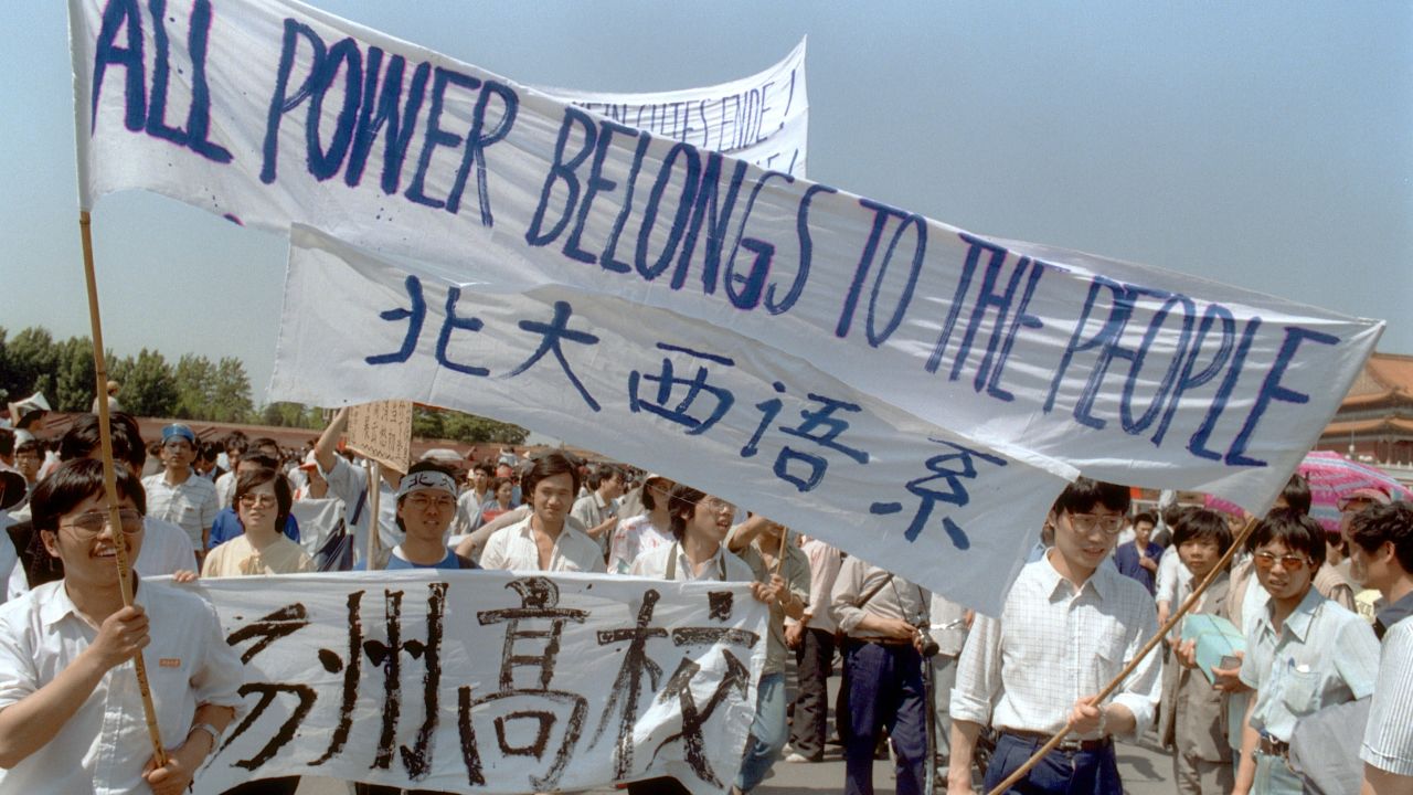 BEIJING, CHINA - MAY 25:  Waving banners, high school students march in Beijing streets near Tiananmen Square 25 May 1989 during a rally to support the pro-democracy protest against the Chinese government. The April-June 1989 movement was crushed by Chinese troops in June when army tanks rolled into Tiananmen Square 04 June.  (Photo credit should read CATHERINE HENRIETTE/AFP/Getty Images)