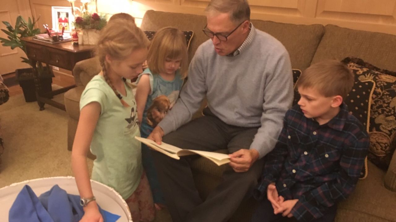Washington Gov. Jay Inslee reads to his grandchildren.