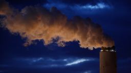 Emissions rise from the coal fired Santee Cooper Cross Generating Station power plant at dusk in Pineville, South Carolina, U.S., on Wednesday, March 21, 2018. Construction of new coal plants around the world fell for the second year in a row in 2017 as the world's biggest polluters began to restrict new projects and explore other technologies. Photographer: Luke Sharrett/Bloomberg via Getty Images