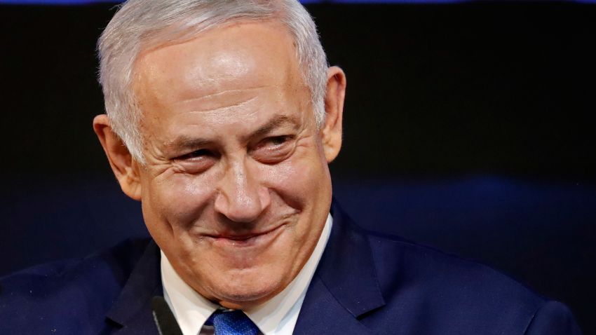 Israeli Prime Minister Benjamin Netanyahu smiles as he addresses supporters on election night at his Likud Party headquarters in the Israeli coastal city of Tel Aviv early on April 10, 2019. The results from yesterday's vote came despite corruption allegations against the 69-year-old premier and put him on track to become Israel's longest-serving prime minister later this year.