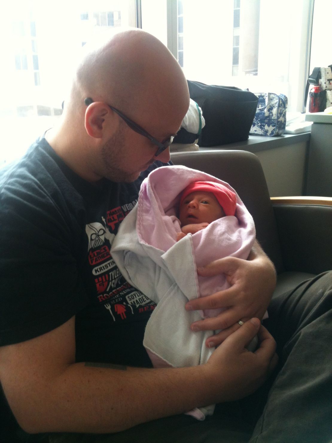 Eric Lohman holds Rosie in the hospital in August 2012.