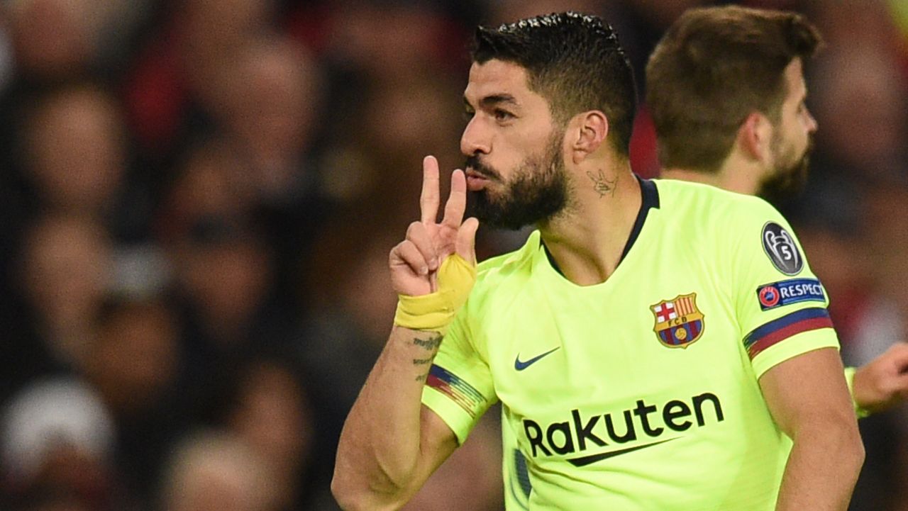 Luis Suarez celebrates after Barcelona open the scoring against Manchester United.