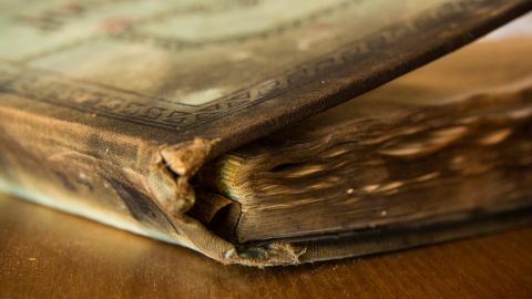 Milburn saved the church ledger from the ruins after the fire.