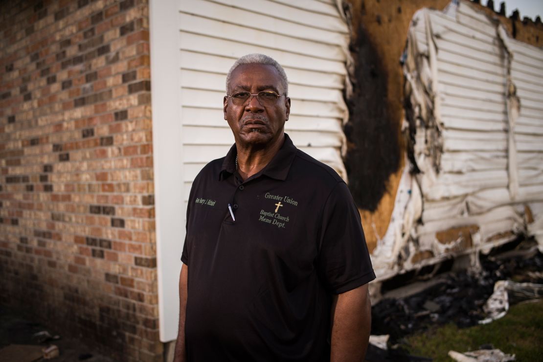 Greater Union Baptist Church Pastor Harry Richard stands for a portrait in front of the ruins of his church building in Opelousas, Louisiana.