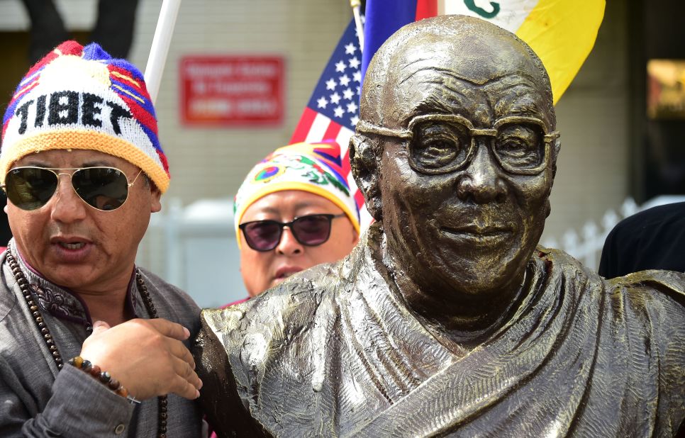 A scuplture of the Dalai Lama, by artist Chen Weiming, is unveiled in Los Angeles during a protest in front of the Consulate General of China in March 2019.