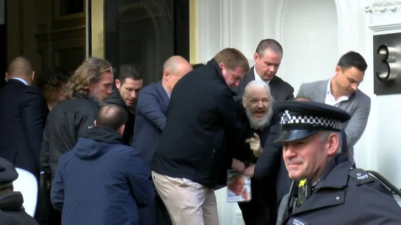 A screen grab from video footage shows the dramatic moment when Assange was <a href="index.php?page=&url=https%3A%2F%2Fedition.cnn.com%2F2019%2F04%2F11%2Fuk%2Fjulian-assange-arrested-gbr-intl%2Findex.html" target="_blank">hauled out of the Ecuadorian Embassy by police</a> on April 11, 2019. Assange was arrested for "failing to surrender to the court" over a warrant issued in 2012. Officers made the initial move to detain Arrange after Ecuador withdrew his asylum and invited authorities into the embassy, citing the Australian's bad behavior.