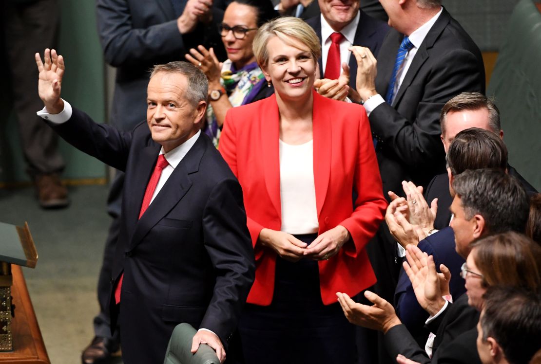 Opposition leader Bill Shorten and Deputy Opposition Leader Tanya Plibersek wave after delivering their budget reply on April 4 in Canberra.