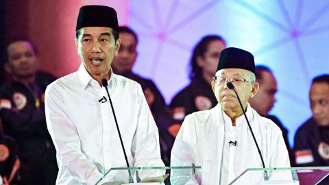 Presidential candidate incumbent President Joko Widodo, left, and his running mate Ma'ruf Amin, right, speak during a live nationwide television debate in Jakarta on January 17, 2019. 