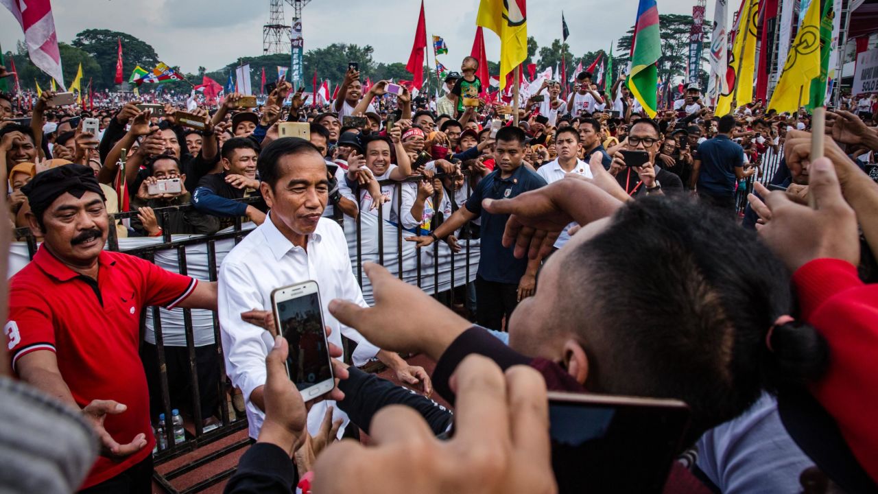Indonesian incumbent Presidential candidate Joko Widodo, is greeted by his supporters at the Sriwedari stadium during an election campaign rally on April 9, 2019 in Solo, Central Java, Indonesia.