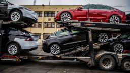 Automobiles produced by Tesla Inc. sit a car transporter truck after arriving on the Glovis Courage vehicles carrier vessel at the Port of Oslo in Oslo, Norway, on Friday, March 15, 2019. Tesla made one of the largest deliveries yet of its new Model 3 car to Norway, one of the electric-vehicle producer's biggest markets. Photographer: Odin Jaeger/Bloomberg via Getty Images