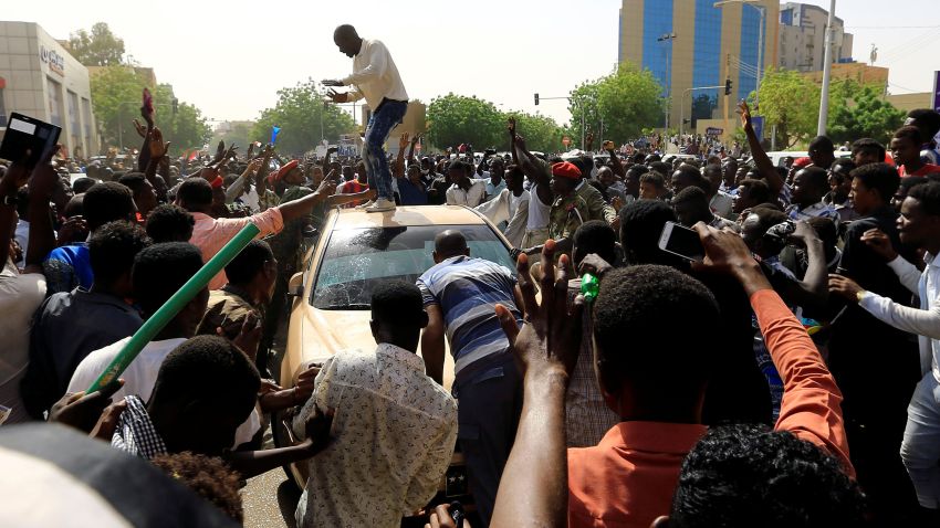 Sudanese demonstrators block the vehicle of a military officer as they chant slogans as they protest against the army's announcement that President Omar al-Bashir would be replaced by a military-led transitional council, in Khartoum, Sudan April 11, 2019. REUTERS/Stringer
